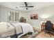 Bright bedroom with a ceiling fan, television, and wooden desk at 9781 E Gamble Ln, Scottsdale, AZ 85262