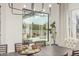 Dining room with neutral walls, modern light fixture and view of swimming pool at 9781 E Gamble Ln, Scottsdale, AZ 85262