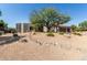 Charming single-story home featuring desert landscaping, mature shade tree, and a two-car garage at 9781 E Gamble Ln, Scottsdale, AZ 85262