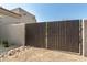 Contemporary horizontal slat gate design provides privacy for the property's entrance at 9781 E Gamble Ln, Scottsdale, AZ 85262