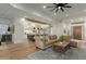 Open-concept living space with kitchen view and hardwood flooring at 9781 E Gamble Ln, Scottsdale, AZ 85262