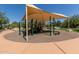 Community playground with sun shade, various climbing apparatuses and soft landing material at 9781 E Gamble Ln, Scottsdale, AZ 85262