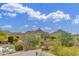 Stunning aerial view overlooking the desert landscape with inviting pool and lounge area at 9781 E Gamble Ln, Scottsdale, AZ 85262