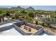 Relax on a scenic roof deck with lounge seating offering views of mountains and desert landscape at 9781 E Gamble Ln, Scottsdale, AZ 85262