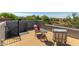 Relaxing roof deck featuring cozy chairs, mountain views and wrought iron railing at 9781 E Gamble Ln, Scottsdale, AZ 85262