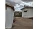 View of the backyard and buildings looking downhill towards the valley at 981 N Sherwood Way, Queen Valley, AZ 85118