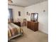 This bedroom features ample storage with a dresser and a bedside table at 981 N Sherwood Way, Queen Valley, AZ 85118