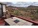 Enjoy mountain views from this home's deck with tile table at 981 N Sherwood Way, Queen Valley, AZ 85118