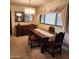 Formal dining room with dark wood table, carpeted floor and natural lighting at 981 N Sherwood Way, Queen Valley, AZ 85118