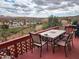 Inviting outdoor patio with a dining set overlooking a scenic desert landscape at 981 N Sherwood Way, Queen Valley, AZ 85118