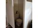 Photo of a toilet stall with tiled floor and concrete walls at 981 N Sherwood Way, Queen Valley, AZ 85118