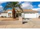 Charming single-story home featuring desert landscaping and a two-car garage at 10216 W Minnezona Ave, Phoenix, AZ 85037