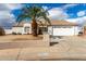 Charming single-story home featuring desert landscaping and a two-car garage at 10216 W Minnezona Ave, Phoenix, AZ 85037