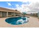 Backyard in-ground pool features cool blue water and a patio surrounding the fenced pool at 10216 W Minnezona Ave, Phoenix, AZ 85037