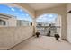 A spacious, covered balcony with beautiful views and decorative red flowers in pots at 10757 N 74Th St # 2003, Scottsdale, AZ 85260