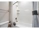 Bright bathroom featuring white tiled walls and a shower-tub combination with modern fixtures at 10757 N 74Th St # 2003, Scottsdale, AZ 85260