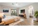 Serene bedroom features a balcony access, a modern dresser, and a spa-like bathroom at 10757 N 74Th St # 2003, Scottsdale, AZ 85260