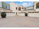 An exterior shot of a home featuring multiple garages and a second-story balcony at 10757 N 74Th St # 2003, Scottsdale, AZ 85260