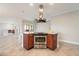 Kitchen island with stainless steel oven and sleek range hood, perfect for cooking and entertaining at 10757 N 74Th St # 2003, Scottsdale, AZ 85260