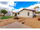 Spacious backyard with rock landscaping, brick accents, and a well-kept lawn at 109 W Kathleen Rd, Phoenix, AZ 85023