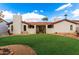 Backyard featuring a well-manicured lawn, desert landscaping, and patio space at 109 W Kathleen Rd, Phoenix, AZ 85023