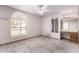 A bright bedroom features shuttered windows, a ceiling fan, and a vanity at 109 W Kathleen Rd, Phoenix, AZ 85023