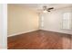 A well-lit bedroom features hardwood floors and a modern ceiling fan at 109 W Kathleen Rd, Phoenix, AZ 85023