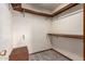 Walk-in closet features wood shelves and neutral walls at 109 W Kathleen Rd, Phoenix, AZ 85023