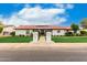 Charming single-story home with a red tile roof, green lawn, mature trees, and inviting walkway at 109 W Kathleen Rd, Phoenix, AZ 85023