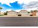 Detached garages with white walls and red tile roofs provide ample parking space at 109 W Kathleen Rd, Phoenix, AZ 85023