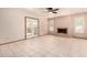 Cozy living room featuring tile flooring, a fireplace, and French doors leading to outdoor space at 109 W Kathleen Rd, Phoenix, AZ 85023