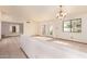 Inviting living room with tile floors, large windows, and neutral walls providing a versatile space at 109 W Kathleen Rd, Phoenix, AZ 85023