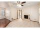 Inviting living room with a cozy fireplace, tile flooring, and a view into the next room at 109 W Kathleen Rd, Phoenix, AZ 85023