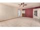 Versatile living space with tile flooring, neutral walls, and a wet bar area for entertaining at 109 W Kathleen Rd, Phoenix, AZ 85023