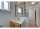 Bathroom vanity features a framed mirror, modern lighting, and a neutral color palette at 111 S Greenfield Rd # 660, Mesa, AZ 85206