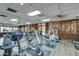 Bright fitness center equipped with cardio machines and floor-to-ceiling mirrors at 111 S Greenfield Rd # 660, Mesa, AZ 85206