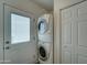 Convenient laundry area with stacked washer and dryer near backdoor and closet at 111 S Greenfield Rd # 660, Mesa, AZ 85206