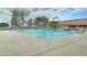 Large community pool with deck area, trees and restrooms at 111 S Greenfield Rd # 660, Mesa, AZ 85206