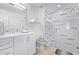 Modern bathroom featuring tiled shower with glass door, granite vanity top, and updated fixtures at 1130 N 2Nd St # 411, Phoenix, AZ 85004