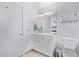 Bathroom featuring an updated vanity with granite counter tops, a designer mirror, and tiled floors at 1130 N 2Nd St # 411, Phoenix, AZ 85004