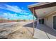 View of backyard with desert landscaping and covered patio area at 11388 N 114Th Dr, Youngtown, AZ 85363