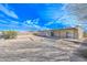 View of the backyard featuring desert landscaping and brick perimeter wall at 11388 N 114Th Dr, Youngtown, AZ 85363