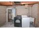 Basement laundry area with new appliances, and water heater at 11388 N 114Th Dr, Youngtown, AZ 85363