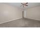 Bedroom featuring neutral colored walls, carpet and a ceiling fan at 11388 N 114Th Dr, Youngtown, AZ 85363