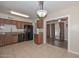 Functional kitchen featuring wooden cabinets, granite countertops, and black appliances at 11388 N 114Th Dr, Youngtown, AZ 85363