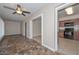 Open concept living room leading to the kitchen and hall at 11388 N 114Th Dr, Youngtown, AZ 85363