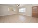 Spacious living room with a large window and tile flooring at 11388 N 114Th Dr, Youngtown, AZ 85363