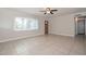 Bright living room with large window and tile flooring at 11388 N 114Th Dr, Youngtown, AZ 85363