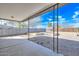 Back patio featuring pillars, view of desert landscaping, and concrete floor at 11388 N 114Th Dr, Youngtown, AZ 85363