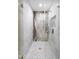 Luxurious marble shower features a glass door, gold hardware, and built-in niche at 11601 N 64Th Pl, Scottsdale, AZ 85254